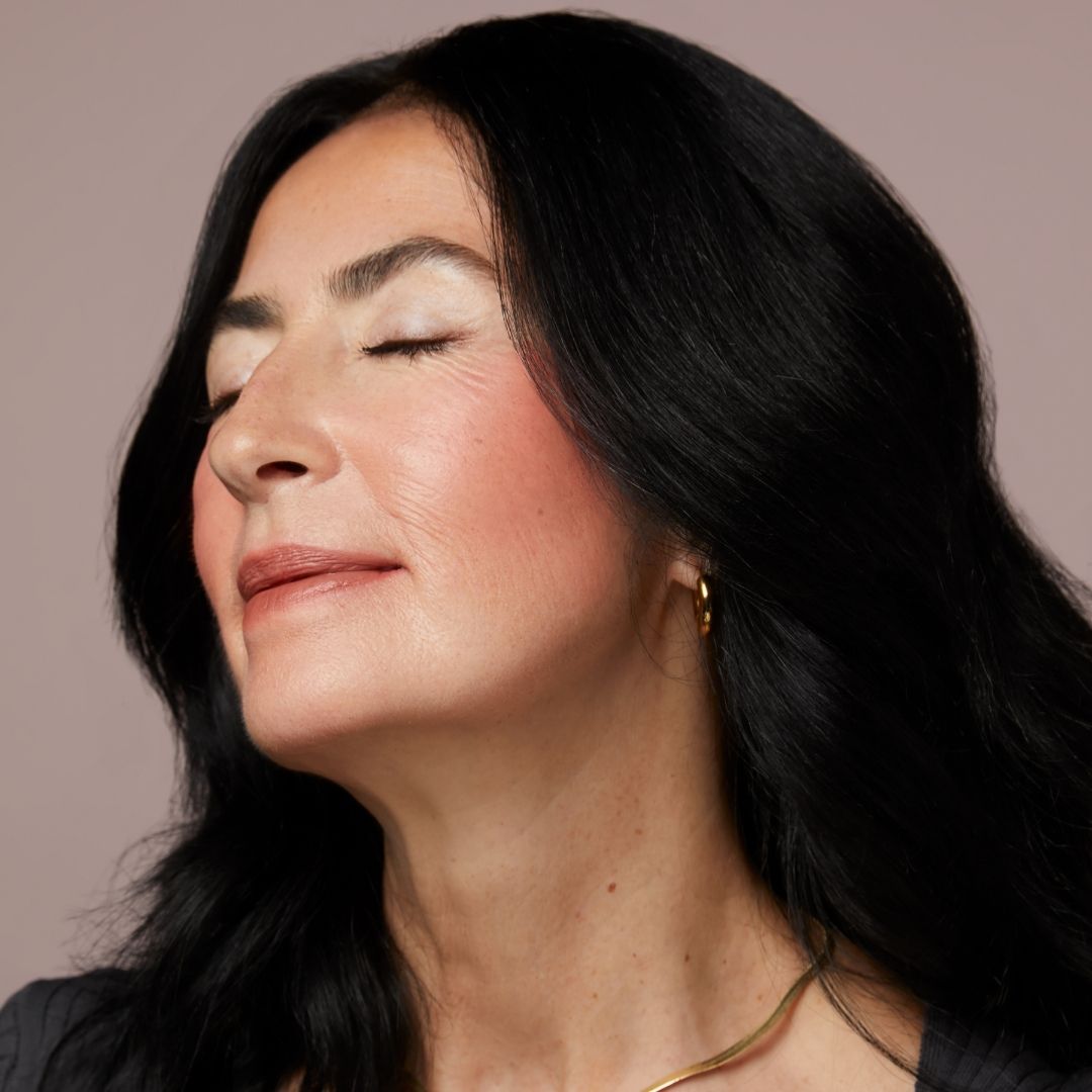 Soft Raisin - A Rosy Terracotta, A Model Wearing Soft Raisin Soft Smudge Lip & Cheek