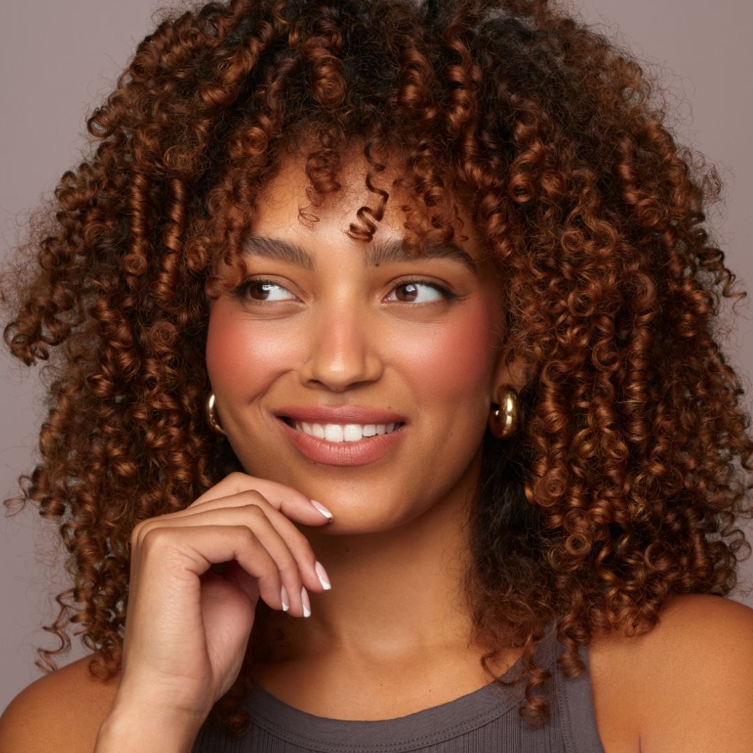 Soft Raisin - A Rosy Terracotta, A Model Wearing Soft Raisin Soft Smudge Lip & Cheek